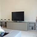 TV and media unit in spraylacquered oak and glass top