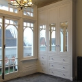Mirrored door fitted wardrobe with drawers