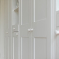Wall-to-wall fitted wardrobe with open shelves - handle detail