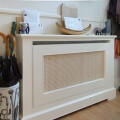Radiator cover with natural cane mesh