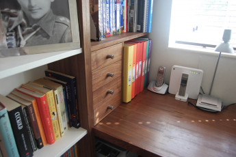 Bespoke home study with desk and shelves in walnut - part view 2