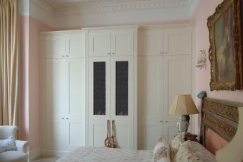 Large wall-to-wall fitted breakfront wardrobe